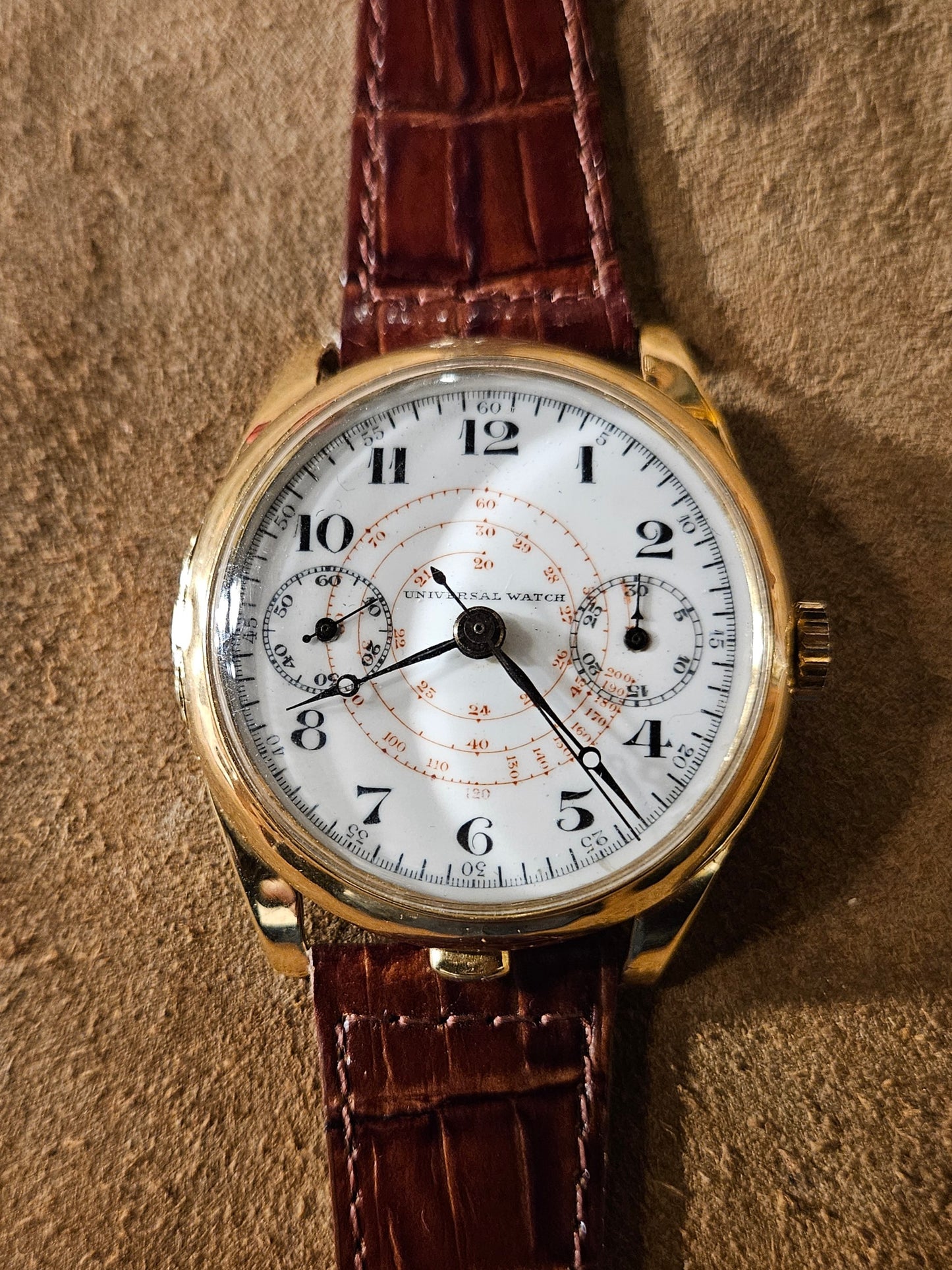 Universal Watch Mono pusher from the 1930s.